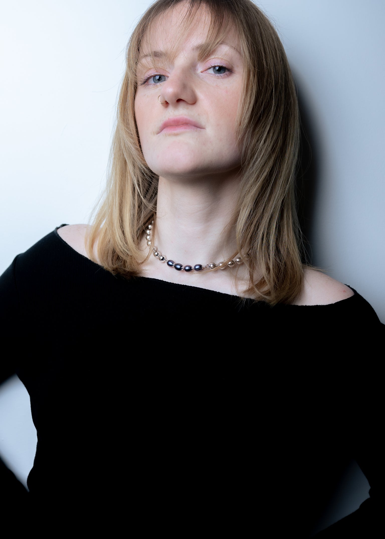 Model wearing Diarra Busso necklace close to the neck