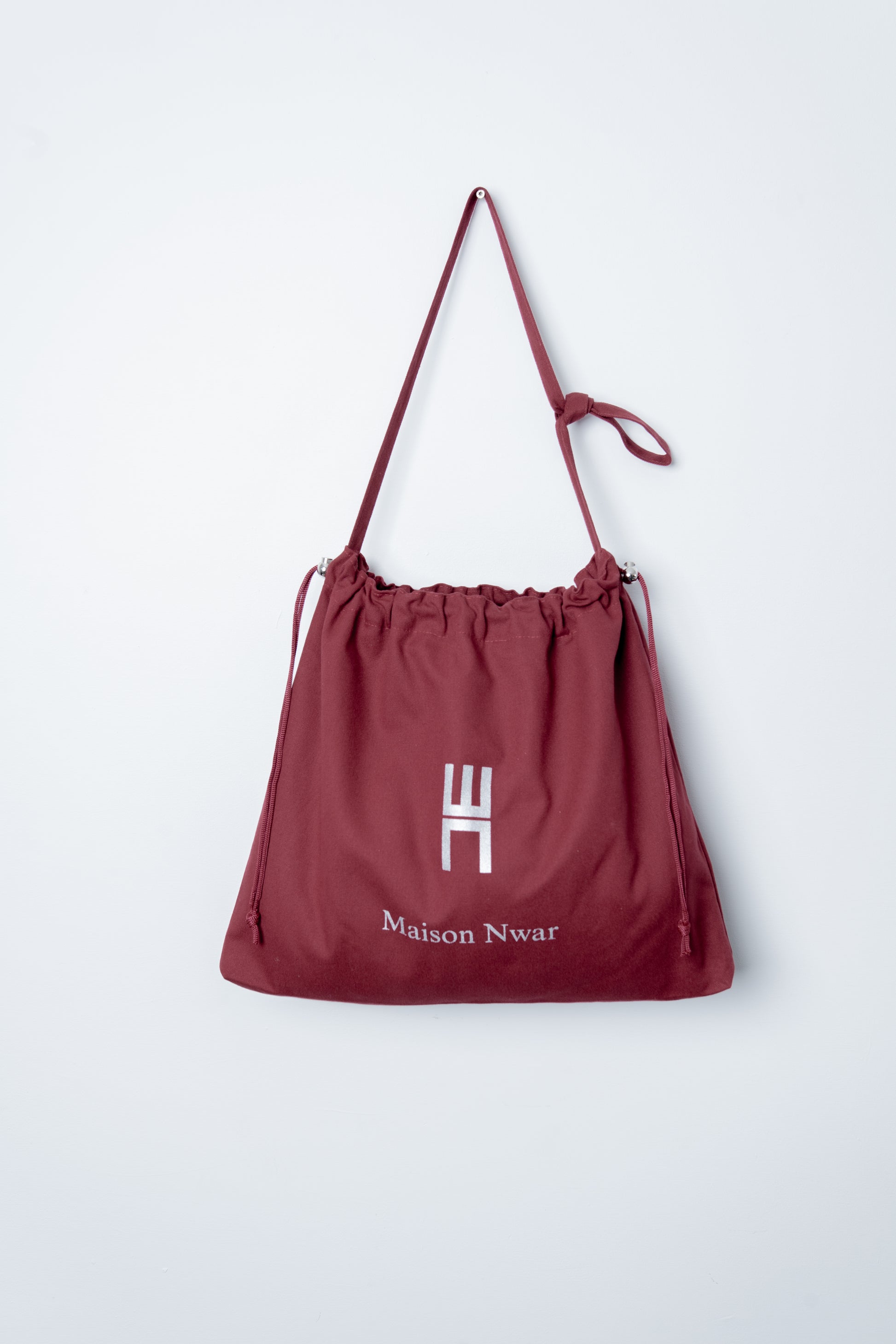 Maison Nwar Tote Bag – drawstring closure with metal bead detail