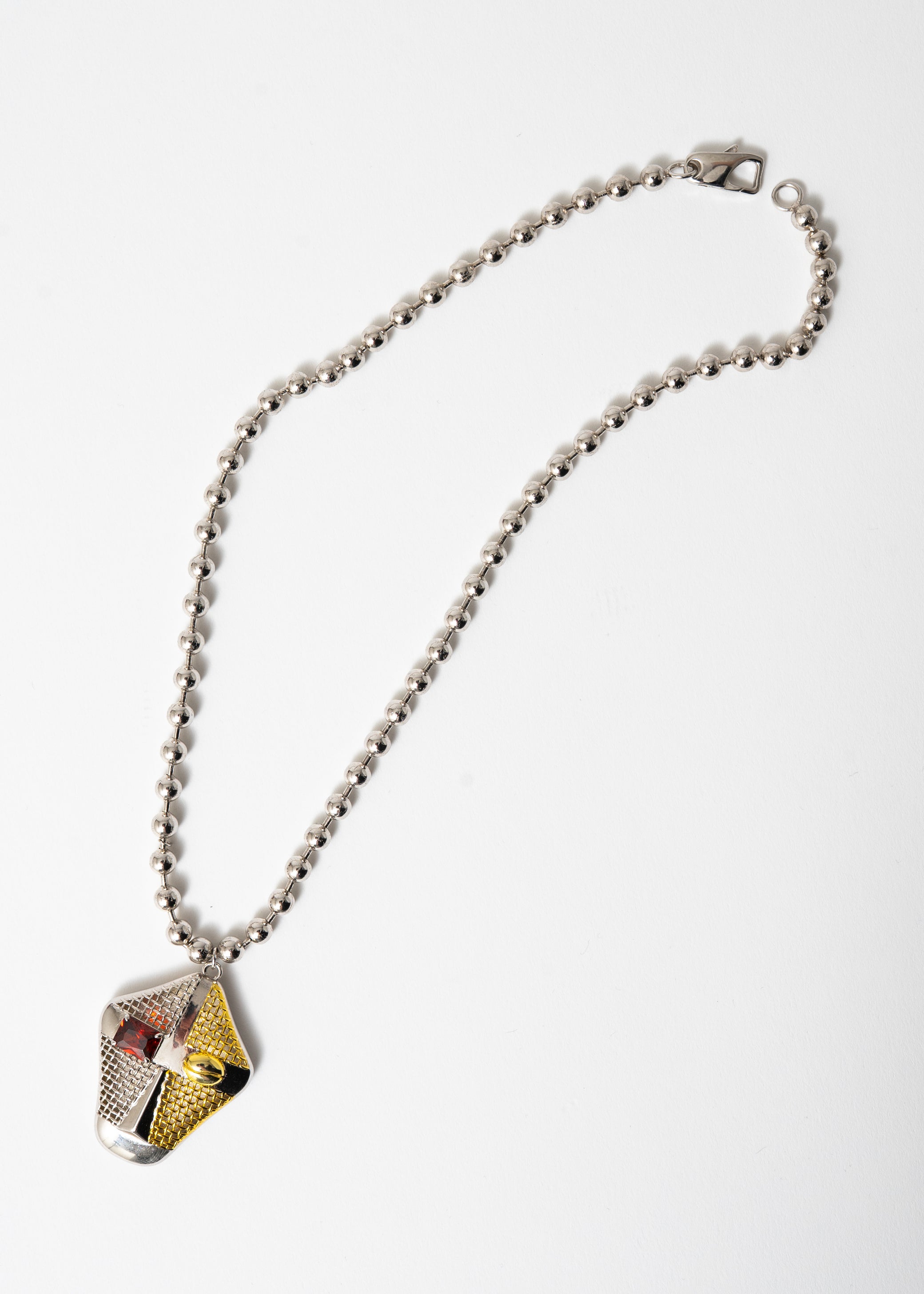 Maison Nwar satin link necklace in sterling silver with sculptural red CZ pendant