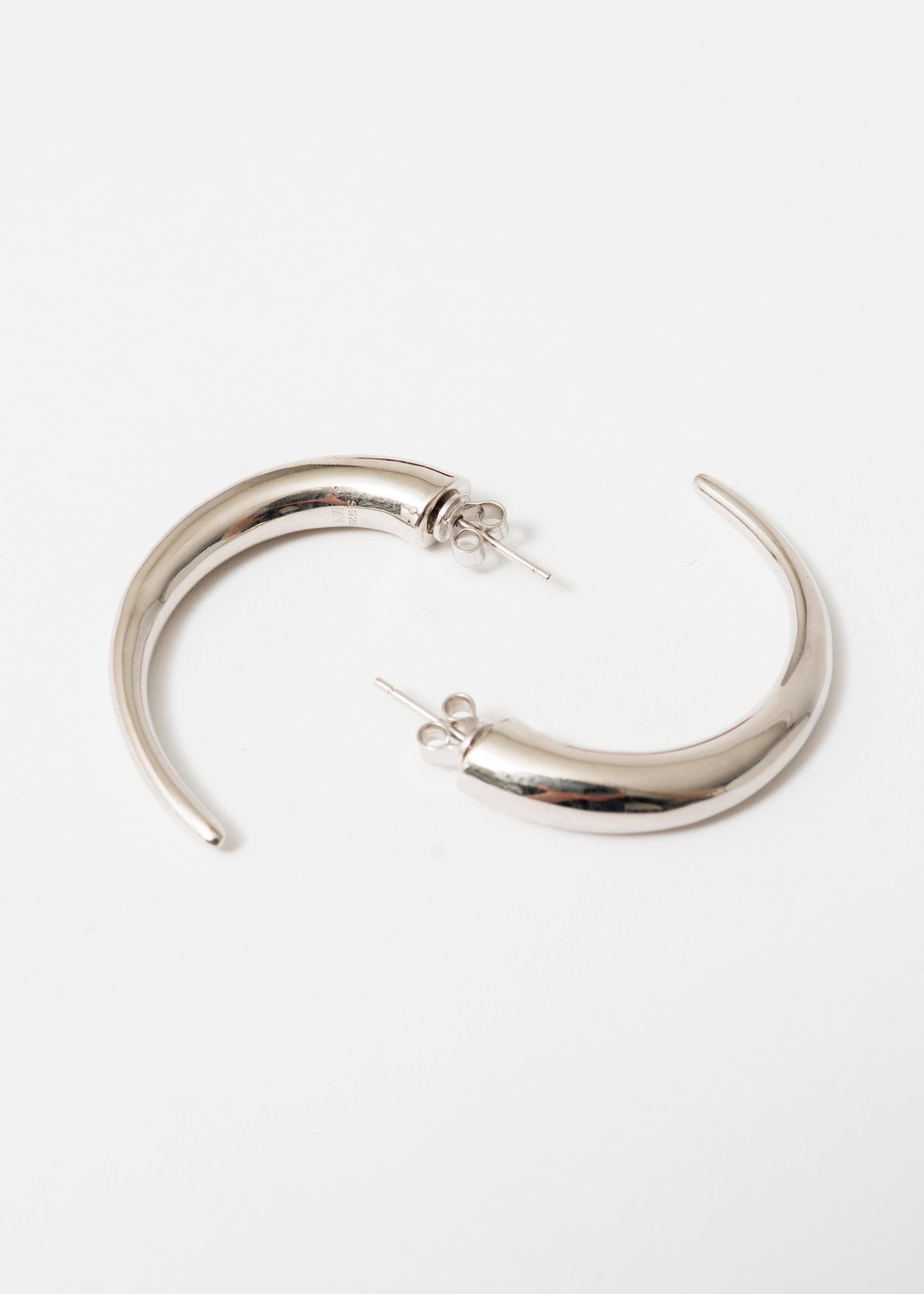 Maison Nwar sculptural silver hoop earring — S925 sterling silver with hand-textured surface