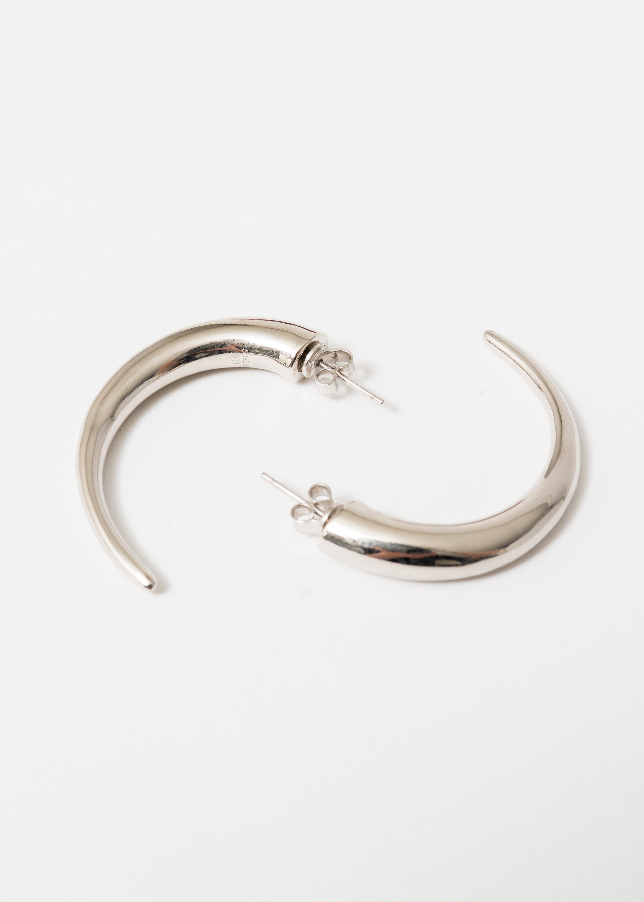 Maison Nwar sculptural silver hoop earring — S925 sterling silver with hand-textured surface