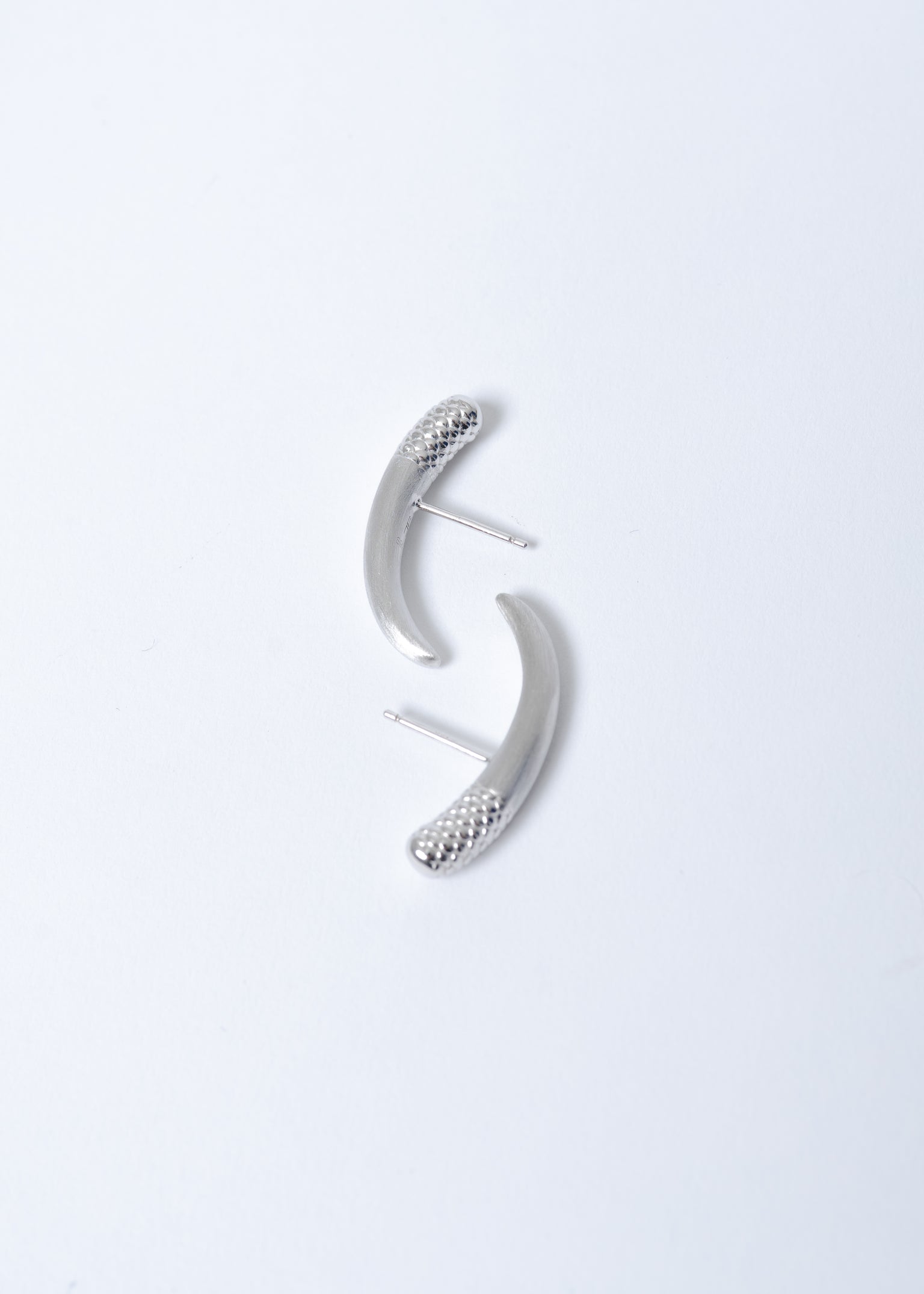 Maison Nwar sculptural hoop earring in sterling silver, studio product shot