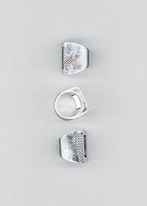 Maison Nwar ring set shown from multiple angles on grey background