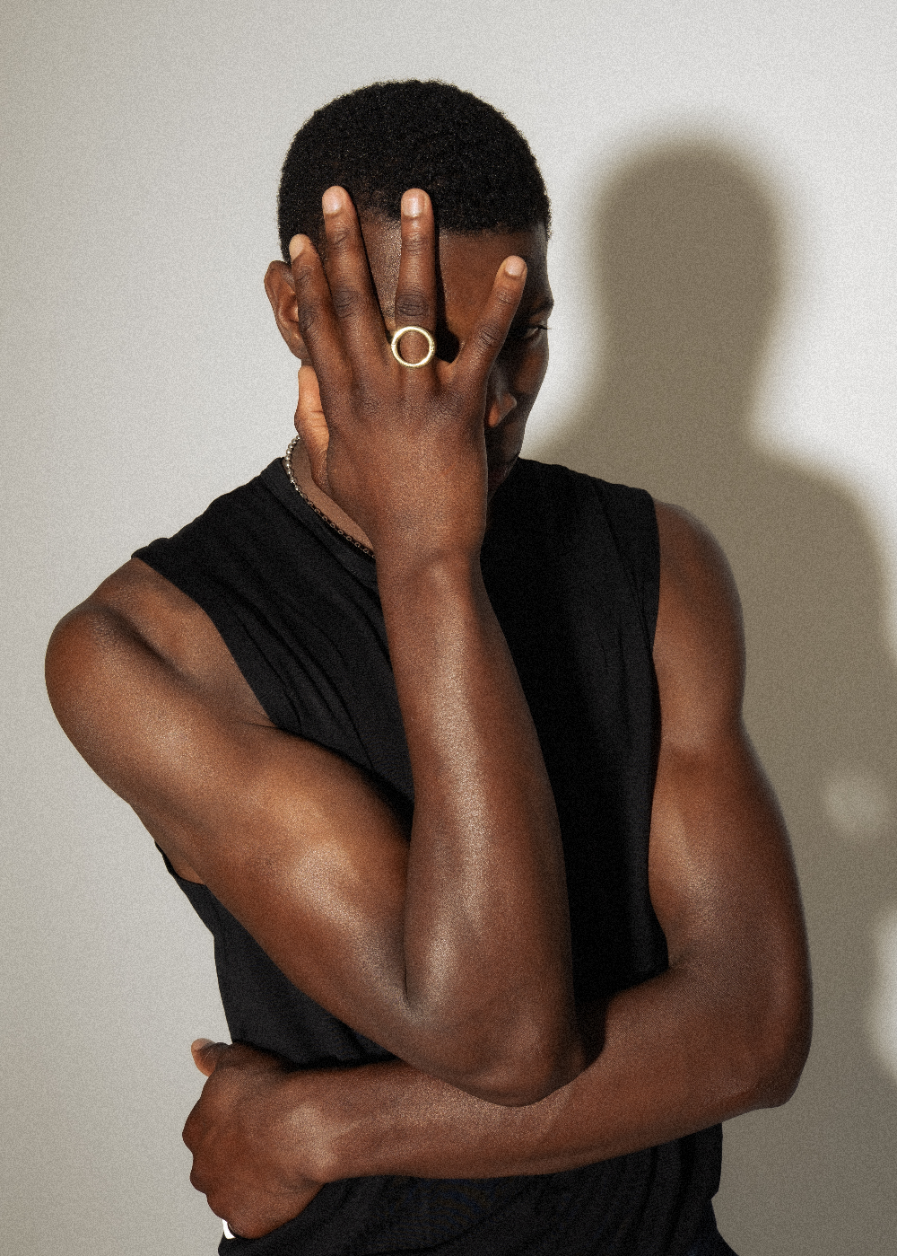 Model wearing Maison Nwar gold vermeil sculpted ring — poetic, hollowed design in sterling silver