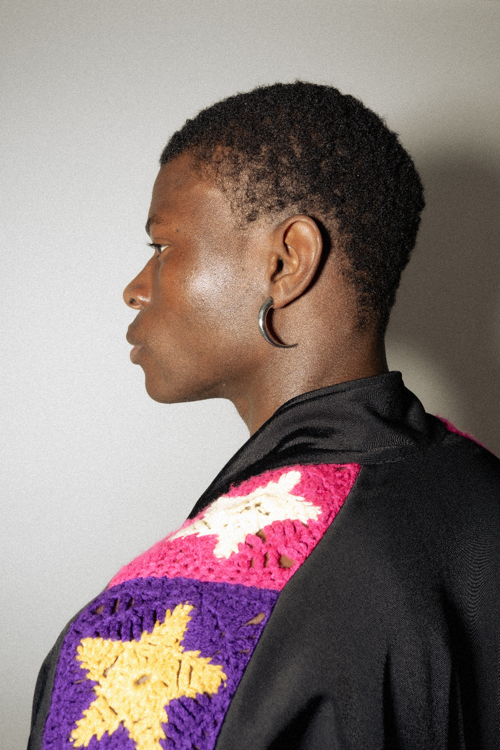 Maison Nwar hoop earring worn asymmetrically — bold 925 silver curve